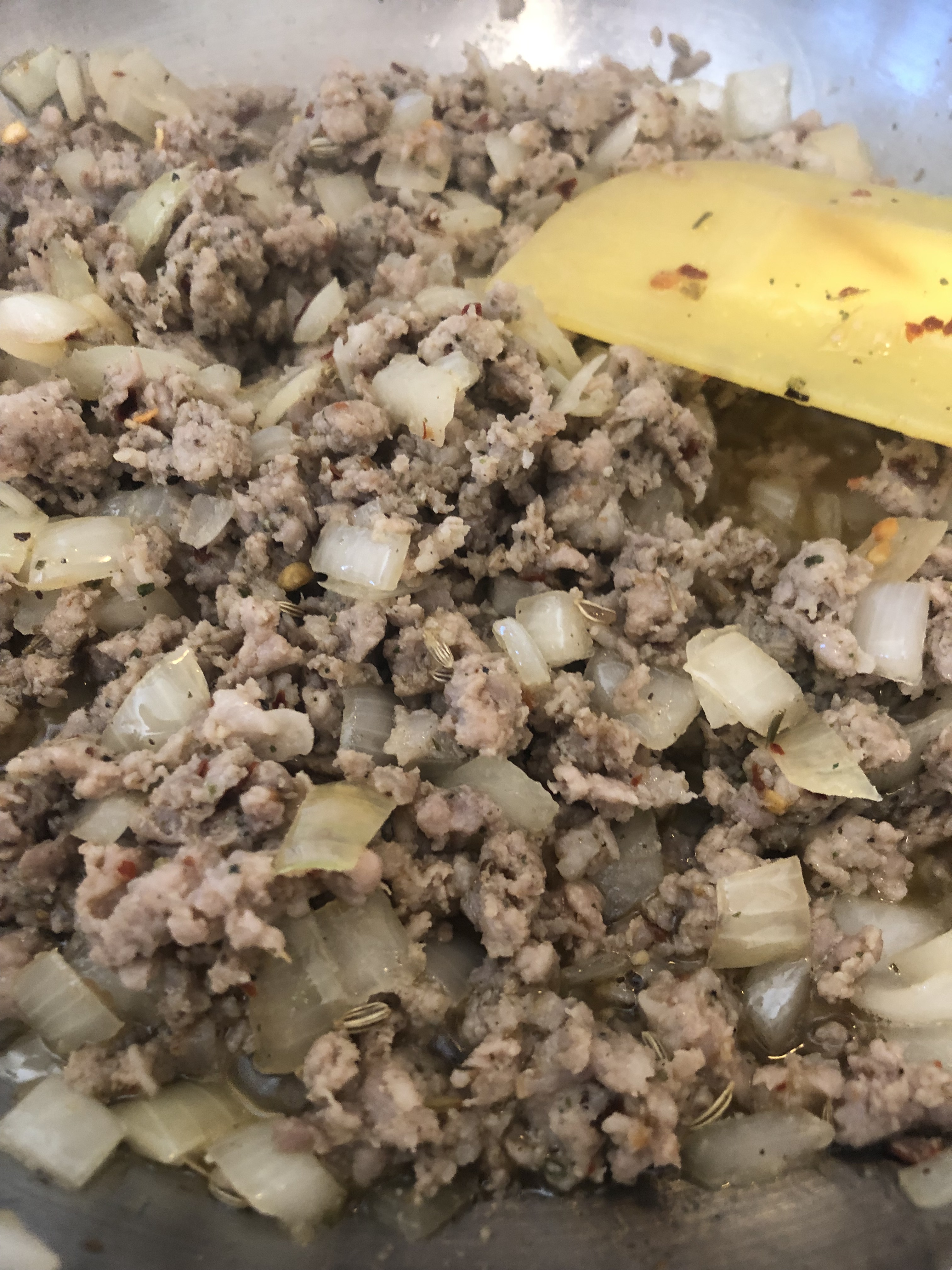 Sautéing homemade Italian sausage mixture with onions